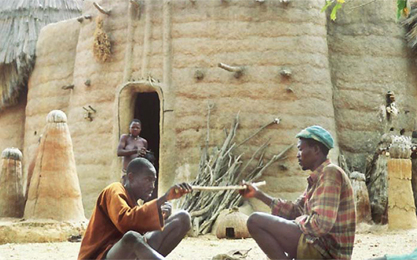 Batammariba practising divination in front of a
'takyiènta'